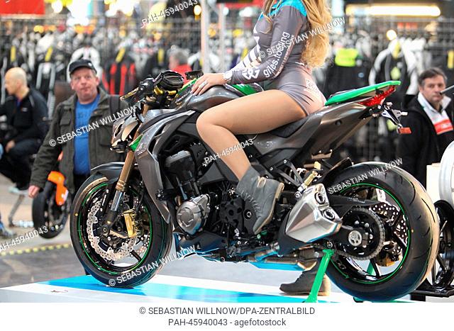 A model poses on a Kawasaki Z 1000 motorcycle at the booth of the Luxembourg accessories manufacturer Gilles at the motorcycle trade fair in Leipzig, Germany