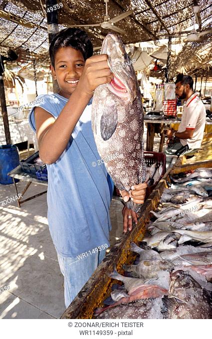 Young boy with a grouper