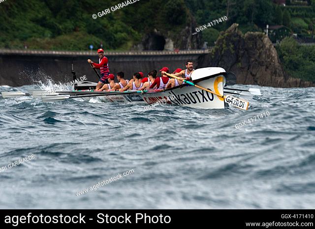 Crew of Ondarroa rowing boat in action during XIV. Getariako Ikurrina men’s regatta of the ACT League (The Association of Clubs of rowing boats)