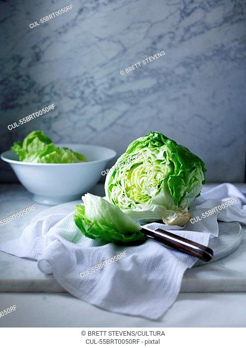 Iceberg lettuce on white tea towel