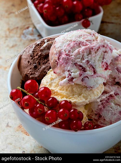 homemade ice cream with currant in white bowl