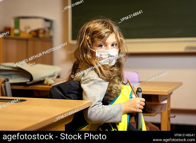 ATTENTION EDITORS: EDITORIAL USE ONLY IN THE CONTEXT OF THE COVID-19 PANDEMIC SAFETY MEASURES ..This staged picture shows a six-year-old demonstrating the...