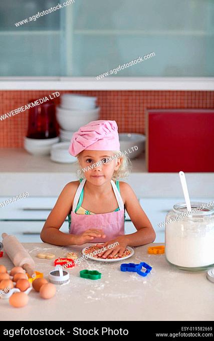 Cute girl baking in at home