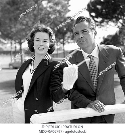 Italian actor Rossano Brazzi and British actress Dawn Addams attending a match of polo. Rome, 1957