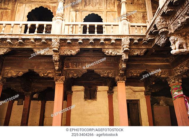 Structural wood work and heavily carved wooden pillars Palashikar Wada at Palashi, Ahmednagar District, Maharashtra, India