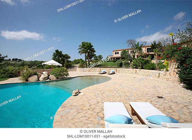 Outdoor swimming pool and stone patio