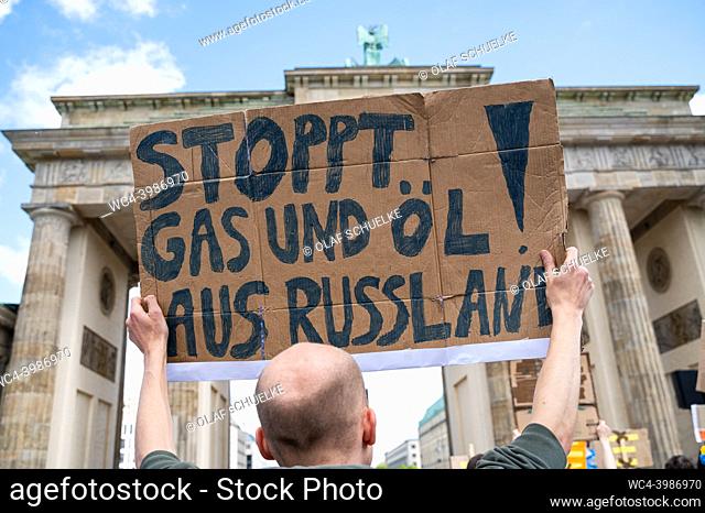 Berlin, Germany, Europe - A man along with other activists protests at a demonstration at the Brandenburg Gate according to the motto ""March with Ukraine