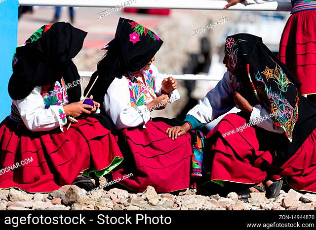 typical costumes in Amantani on the Titicaca lake