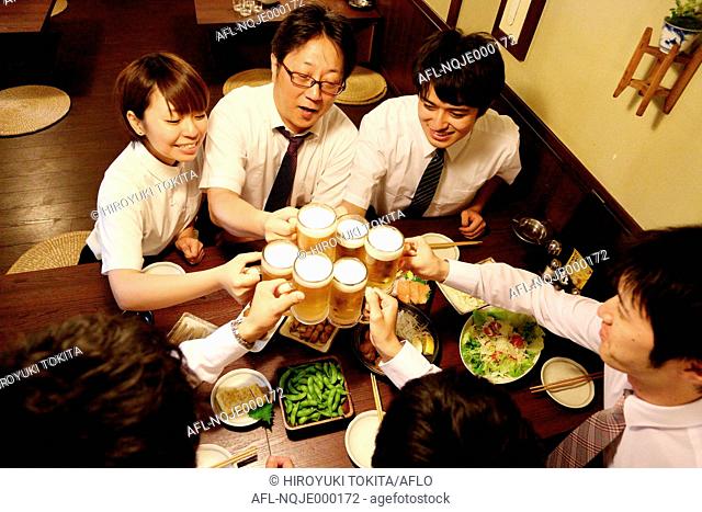 Japanese business people drinking at a Japanese style Izakaya