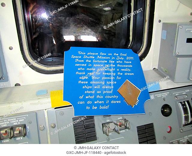 The crew of STS-135 left this plaque in the cockpit of Atlantis as a tribute to all of the people who have worked on the Space Shuttle Program