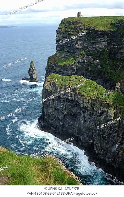 The Cliffs of Moher seen at the south west coast in County Clare, Ireland, 05 June 2017. The cliffs rise above Atlantic Ocean and stretch eight kilometres along...