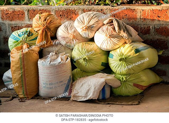 Storage of rice sacks Maharashtra India Asia