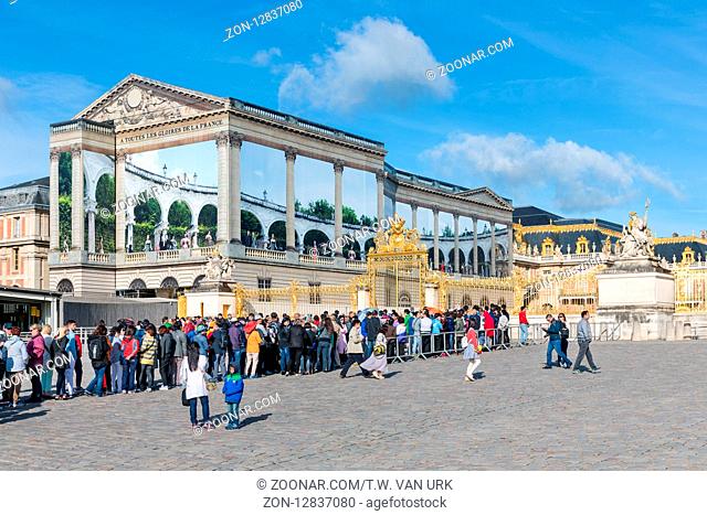 VERSAILLES PARIS, FRANCE - MAY 30: Visitors waiting in a queue to visit the Royal Chateau of Versailles on May 30, 2015 at Versailles near Paris, France