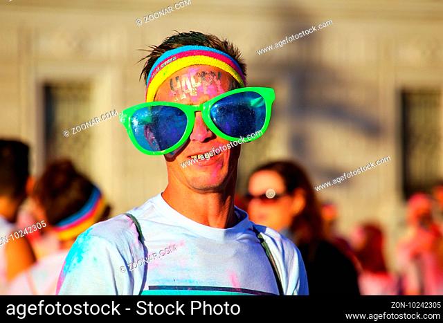 Portrait of a man taking part in The Color Run in Trieste, Italy. Trieste is the capital of the autonomous region Friuli-Venezia Giulia