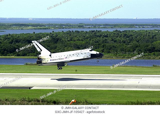 KENNEDY SPACE CENTER, FLA. -- Space Shuttle Atlantis casts a needle-shaped shadow as it drops to the runway at the Shuttle Landing Facility, completing the 4