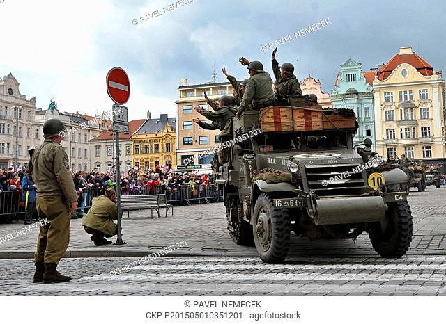 World War II re-enactors dressed as U.S. Army soldiers arrive the Republic's Square on original military cars to mark the 70th anniversary of the liberation...