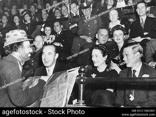 At the Circus: The Duke of Windsor laughing heartily at a clown as he and the Duchess Witness the circus at Madison Square Garden, New York