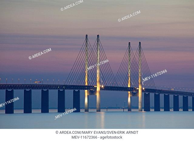Oeresund railway and dual carriageway bridge-tunnel between Denmark and Sweden at sunset