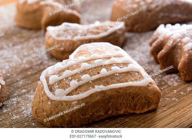 Gingerbread cookies on plate covered with powdered sugar