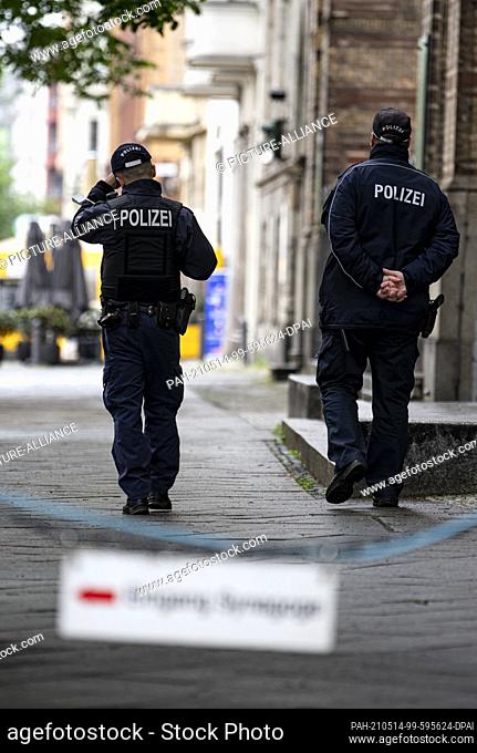 14 May 2021, Berlin: Two policemen walk past the entrance to the New Synagogue Berlin. Photo: Fabian Sommer/dpa. - Berlin/Berlin/Germany