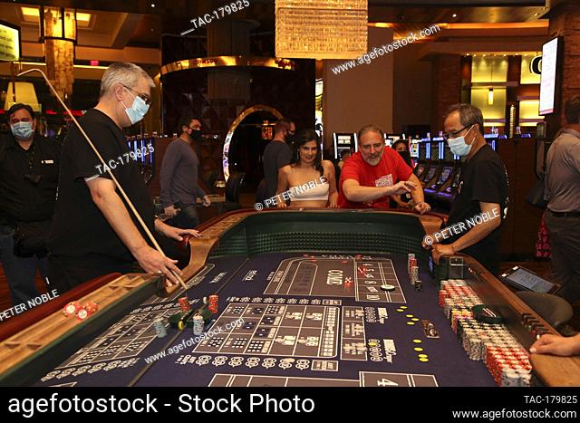 Las Vegas, NV - June 4, 2020: People play Craps during the Grand Re-Opening of Red Rock Casino Resort & Spa at 12:01 AM on June 4, 2020 in Las Vegas, Nevada