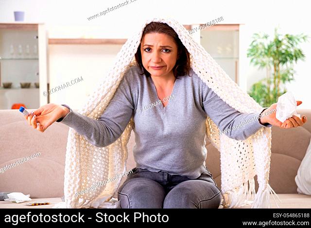 Sick middle-aged woman suffering at home