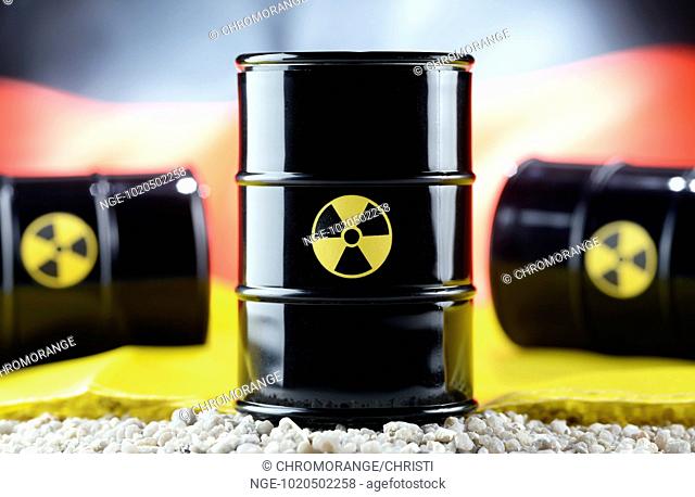 Atomic waste barrels in front of German national colours