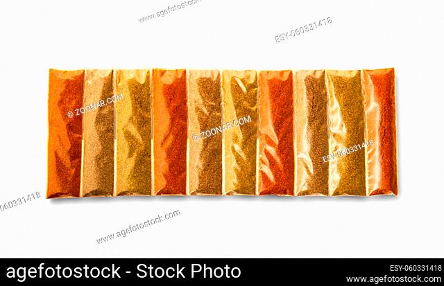 Collection of different spices in packaging isolated on white background