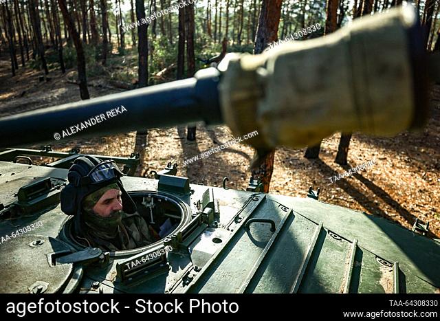 RUSSIA, LUGANSK PEOPLE'S REPUBLIC - NOVEMBER 1, 2023: A serviceman of the Ulyanovsk volunteer battalion of the Central Military District on a BMP-2 amphibious...