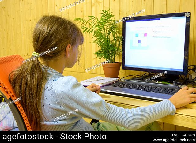 A student passes distance learning tasks on a computer
