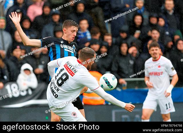 Club's Jorne Spileers and Miss Belgium 2018 Angeline Flor Pua fight for the ball during a soccer match between Club Brugge and Royal Antwerp FC