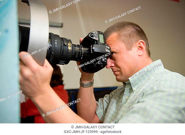 Russian cosmonaut Dmitry Kondratyev, Expedition 26 flight engineer and Expedition 27 commander, participates in a docking timeline simulation training session...