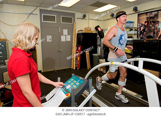 NASA astronaut Dan Burbank, Expedition 29 flight engineer and Expedition 30 commander, participates in a treadmill kinematics baseline data collection session...