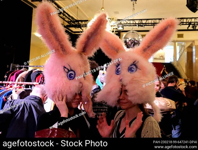 18 February 2023, Saxony, Leipzig: Two women try on bunny masks in the play. A costume run is held there again after a three-year break