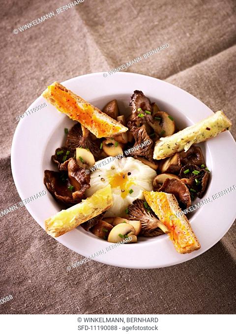 Poached egg with mushrooms and savoury bread sticks