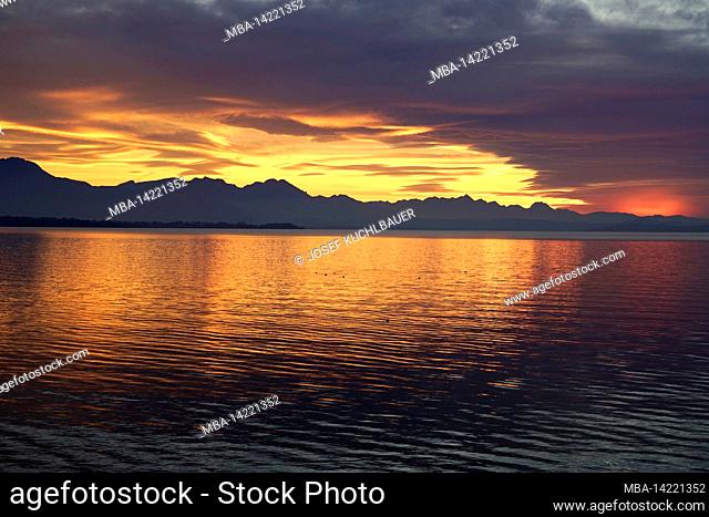 Germany, Bavaria, Upper Bavaria, Traunstein district, Chieming, Chiemsee, sunset behind dark clouds