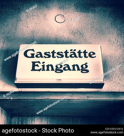 old German door sign of a restaurant of the 60s