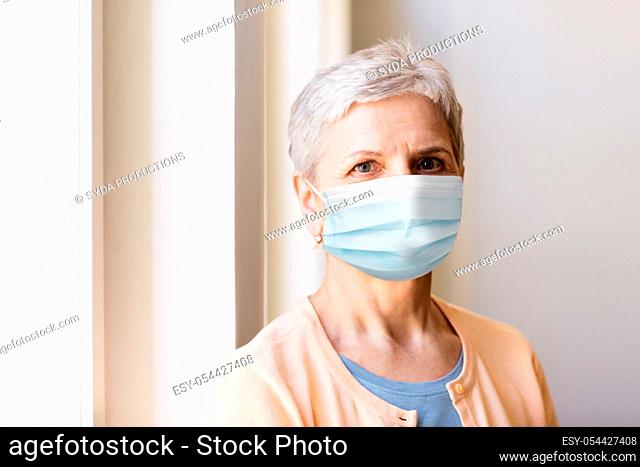 senior woman in protective medical mask