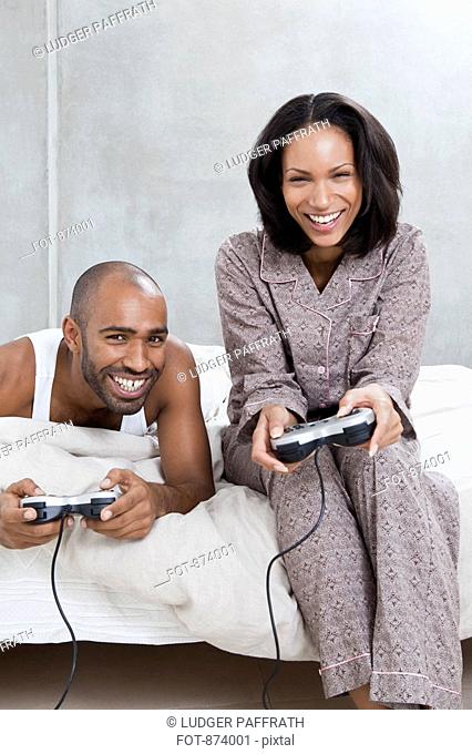 A young couple playing a video game
