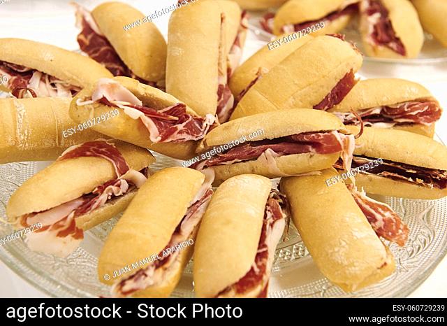 Small baguettes of Iberian ham ready to eat