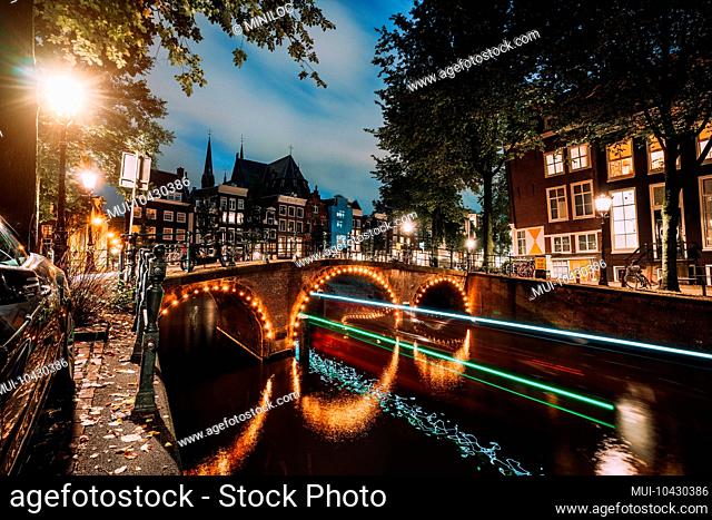 Light trails at famous canals in Amsterdam at dusk. Long exposure shot
