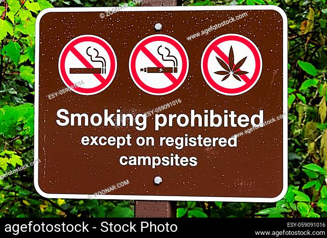 A smoking prohibited except on registered campsite sign