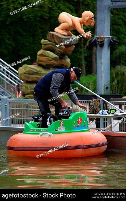 14 May 2020, Saxony-Anhalt, Thale: An employee of Seilbahnen Thale GmbH tests electric boats in the radio park in Thale. It is still uncertain when the...
