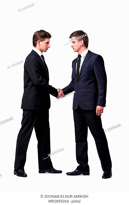 Two twin brothers handshaking isolated on white