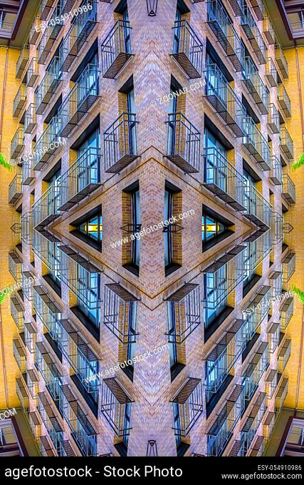 An apartment complex balconies with complex design. Geometric kaleidoscope pattern on mirrored axis of symmetry reflection