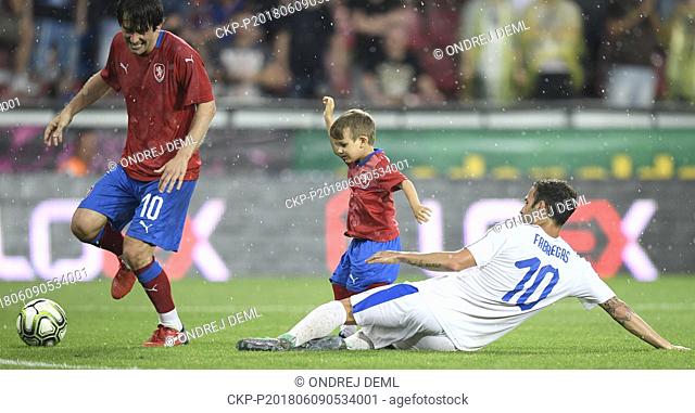 Tomas Rosicky and his son Tomas Rosicky Jr of Czech team and Cesc Fabregas of TR10 World Team in action during the match