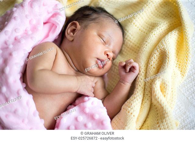 newborn mixed baby girl sleeping