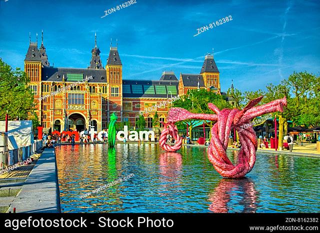 Sculptures in water near Rijksmuseum Amsterdam museum in Holland, Netherlads, HDR