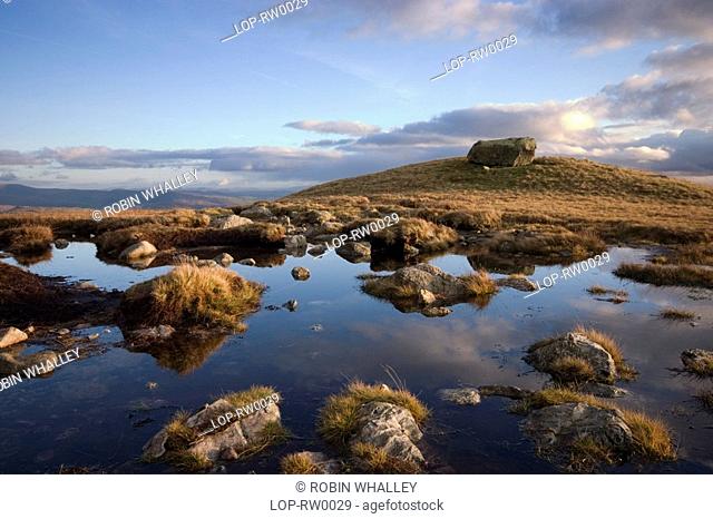 England, Cumbria, Langdale Pikes, Sky reflected in a pool. 'Once seen, never forgotten' wrote Alfred Wainwright, the Langdale Pikes are ever popular among...