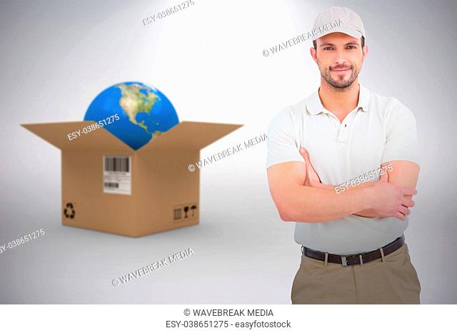 Composite 3d image of delivery man standing arms crossed